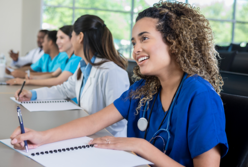 Nurse taking notes in a class