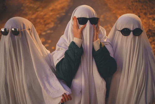 3 people dressed as ghosts