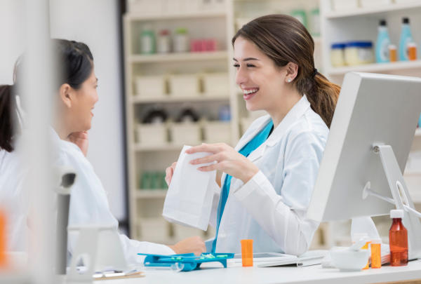 Young pharmacist smiling