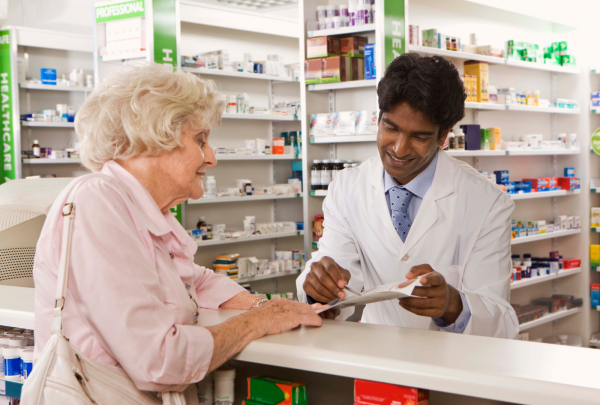 Pharmacist talking with an elderly patient