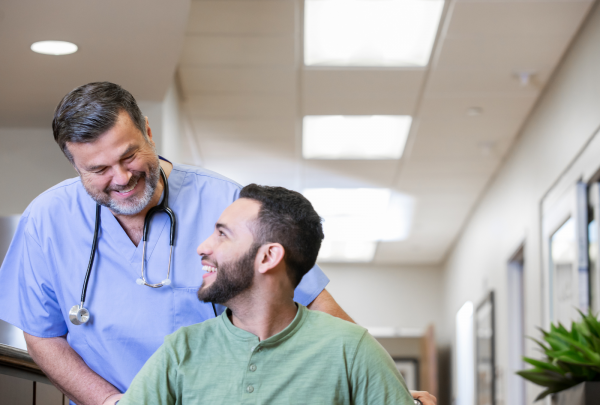 Nurse smiling at his patient 