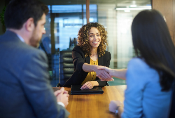 two women shaking hands at a job interview