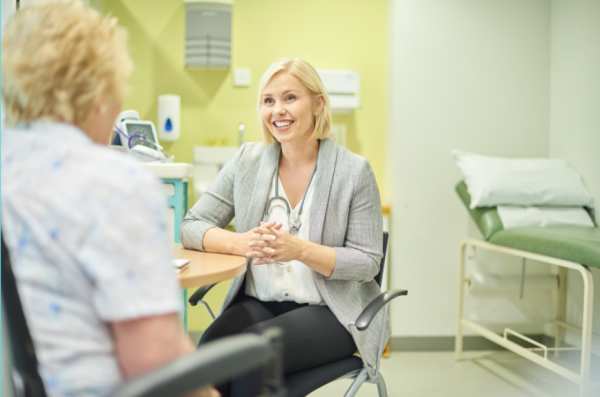 GP sitting in her room having a consultation with a patient